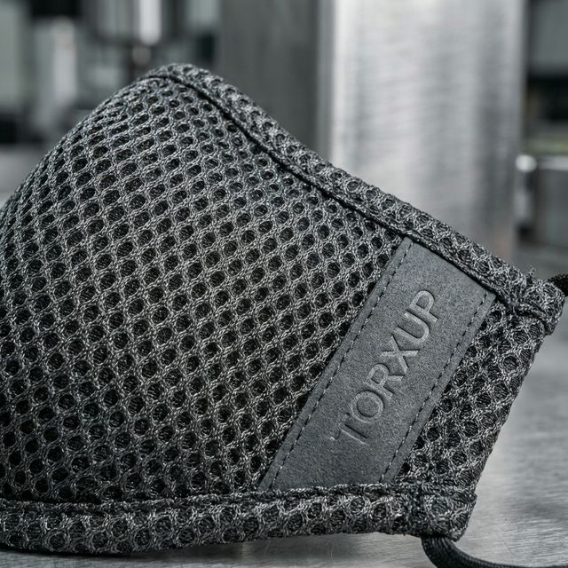 Macro view of the chemical-resistant exterior fabric and wipe-clean surface of the ProDefend.